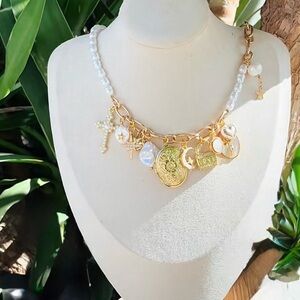 Brand new. Never worn. Gold and Pearl Charm Necklace